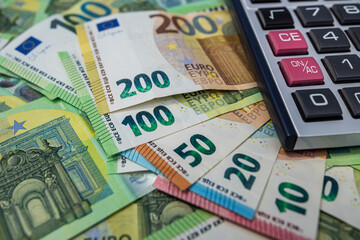 Euro banknotes with calculator, financial accounting, investment planning and business budget concept
