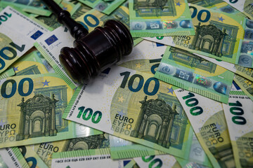 Euro banknotes with judge gavel, legal justice, regulation and business corruption concept