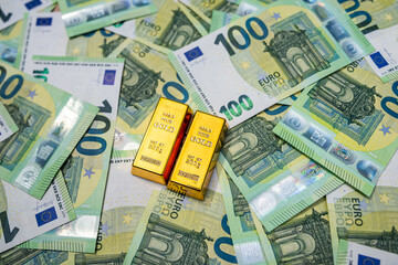 Obraz premium Gold bullion with euro notes, financial prosperity, global economy and investment concept