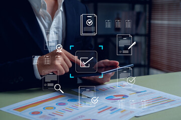 business professional using a tablet for digital document approval and data analysis. Concept of paperless workflow, e-signature, compliance management, and online business automation.