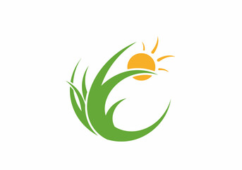 A stylized green grass with a bright orange sun rising behind it, symbolizing growth and nature.