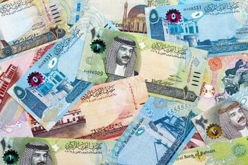 Bahraini dinar currency money bills. The current banknotes lies on table in big amount close up