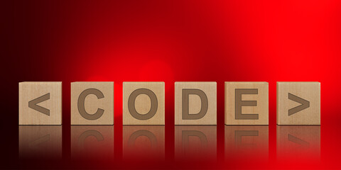Wooden cubes with CODE word on abstract background technology concept and programming