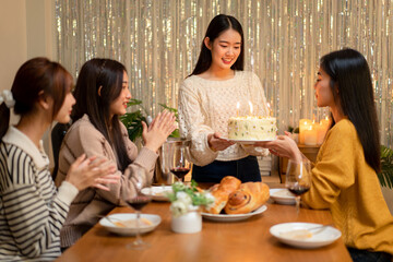 Birthday Celebration with Friends Asian Young Women Enjoying Cake and Wine at Home Party Festive Atmosphere Happy Gathering Friendship and Joy