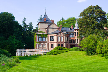 Majestic historic castle surrounded by lush green parkland, Goluchow, Poland
