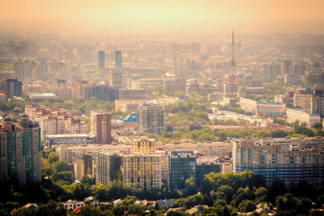 Scenic view of downtown Almaty, Kazakhstan, as seen from Kok-Tobe Mountain at sunset