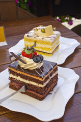 Indulge in delicious gourmet cakes on wooden table