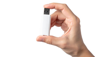 A hand delicately holding a small, white USB flash drive