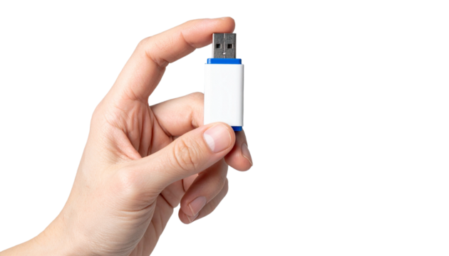 A hand delicately holding a USB flash drive, showcasing technology and data transfer