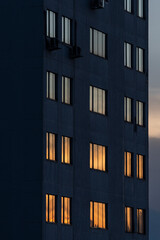 Reflections of orange sunset in windows of a building