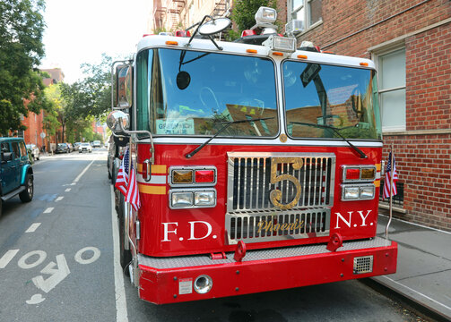 New York, NY, USA - August 25, 2025: red new york fire department engine number five parked on the street in greenwich village