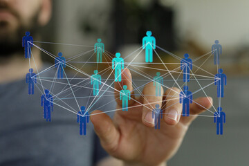 Abstract image of a person touching a network of connected people, symbolizing collaboration,...