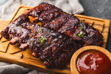 Sliced grilled meat steak Rib eye medium rare set, on wooden serving board, with beans, close up