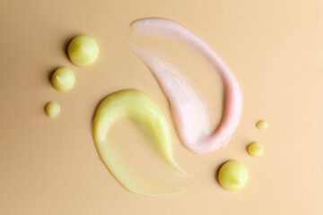 Samples of different cosmetic products on beige background, flat lay