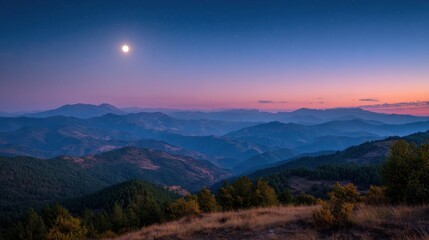 Naklejka premium A tranquil scene unfolds as the moon rises above rolling hills illuminating the serene valley below.