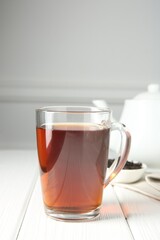 Delicious tea and brew served on white table. Space for text