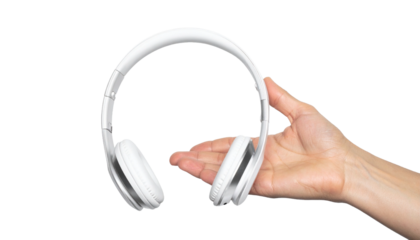 A person's hand delicately presenting a set of white headphones