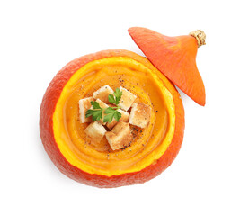 Tasty pumpkin cream soup with croutons and parsley in pumpkin isolated on white, top view