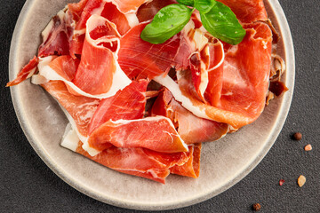 jamon serrano meat appetizer jamon iberico natural product tasty snack fresh delicious gourmet food background on the table rustic top view copy space