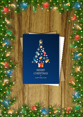A wooden vertical surface decorated with Christmas decorations, a holiday card lies on the table, creating a warm festive atmosphere