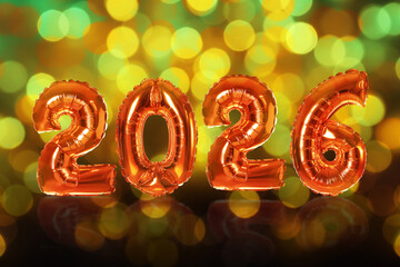 Happy New 2026 Year. Orange balloons in shape of numbers and bokeh lights. Greeting or invitation card design