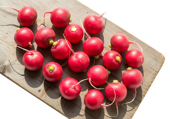 Fresh Radishes on Rustic Wooden Board in Sunlight.