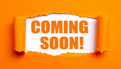 Orange ripped paper edges exposing white layer beneath, bold COMING SOON typography