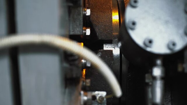 Automated production of uniform helical grooves on polished steel, metal hoses