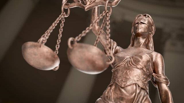 Slow Upward Crane Movement of Lady Justice Statue In A Courthouse Building.
