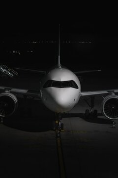 Nighttime Airplane Parked at Gate &ndash; Airport Runway Operations
