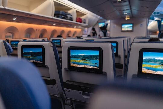 Airplane Cabin Interior with Passenger Seats and Screens &ndash; Modern Air Travel
