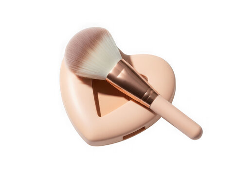 Makeup brush on a heartshaped powder compact 