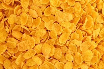 Corn flakes background texture close up. Top view cornflake cereal box for morning breakfast