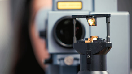 Ophthalmology equipment focused on vision examination, showcasing advanced technology and precision instruments for eye care professionals in a clinical setting with copy space