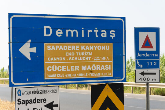 Demirtash, Antalya, Turkey, August, 1, 2025. Demirtas Road Sign With Sapadere Canyon And Dwarf Cave Directions Near Antalya, Turkey. Sunny summer day