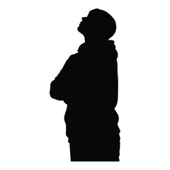 Silhouette of person looking up arms crossed hooded figure casual attire side view silhouette