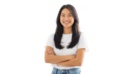 A young asian woman with long dark hair smiles confidently with her arms crossed standing isolated on transparent background