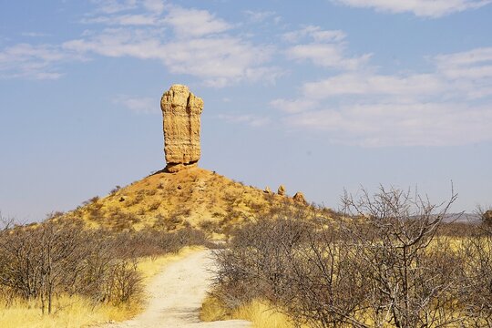 Scenic shot of the Vingerklip, a rock formation in Damaraland in northern Namibia, not far from the Ugab Terraces during the dry season. The sandstone rock needle is ancient and 35 metres high. 