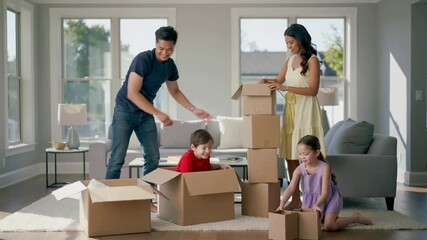 Family unpacking boxes in a bright living room - Powered by Adobe