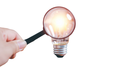 Hand holding a glowing light bulb represents the bright concept of innovation and power