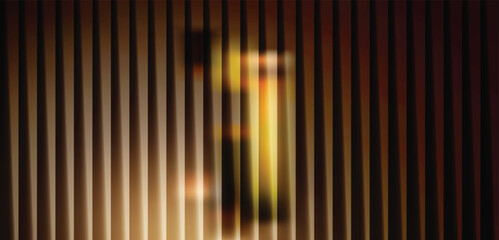 Abstract vertical blinds with warm light creating a blurry, artistic effect, evoking a sense of mystery and depth