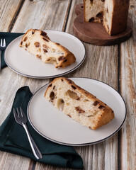 Chocotone, traditional italian cake panettone with chocolate chips over wooden table