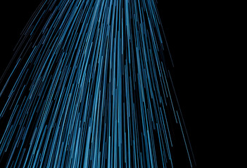 Abstract blue light trails falling down on a black background in motion