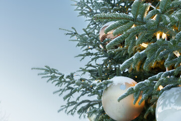 Festive Christmas Tree Decoration Against Clear Blue Sky