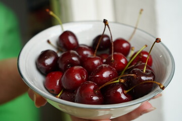 A bowl full of vibrant red cherries, perfect for a healthy snack