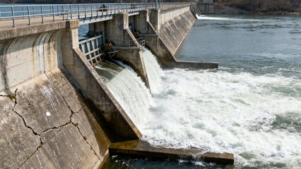 Feel the powerful drama of a dam standing firm against rushing waters
