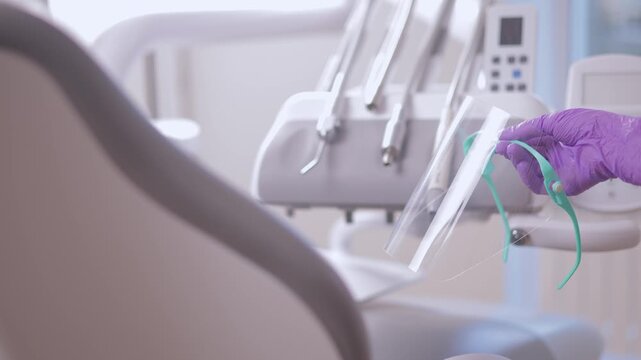 Dental protective gear in clinic setting with focus on hygienic practices.