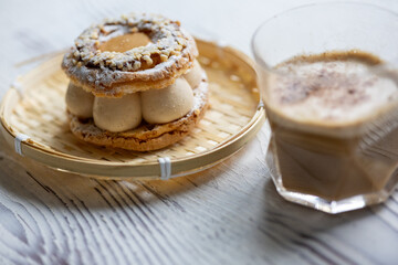 Close-Up of Pistachio and Pumpkin Christmas Paris-Brest Dessert with Pumpkin Latte
