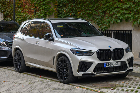 Tbilisi, Georgia 10.23.2025 White BMW X5 parked near a residential building, showing car details, urban environment, and neighborhood context, ideal for automotive and city projects