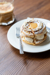 Close-Up of Pistachio and Pumpkin Christmas Paris-Brest Dessert with Pumpkin Latte
